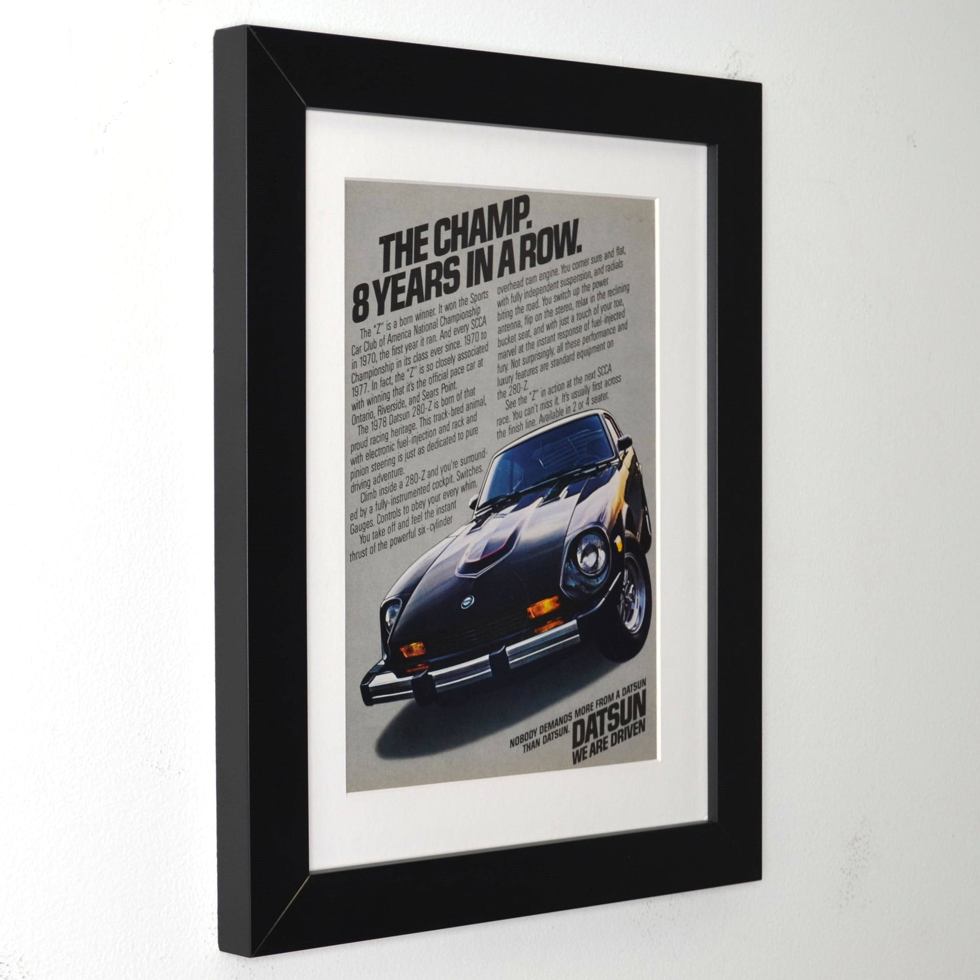 Framed poster of a 1978-datsun-280z with text on a white background