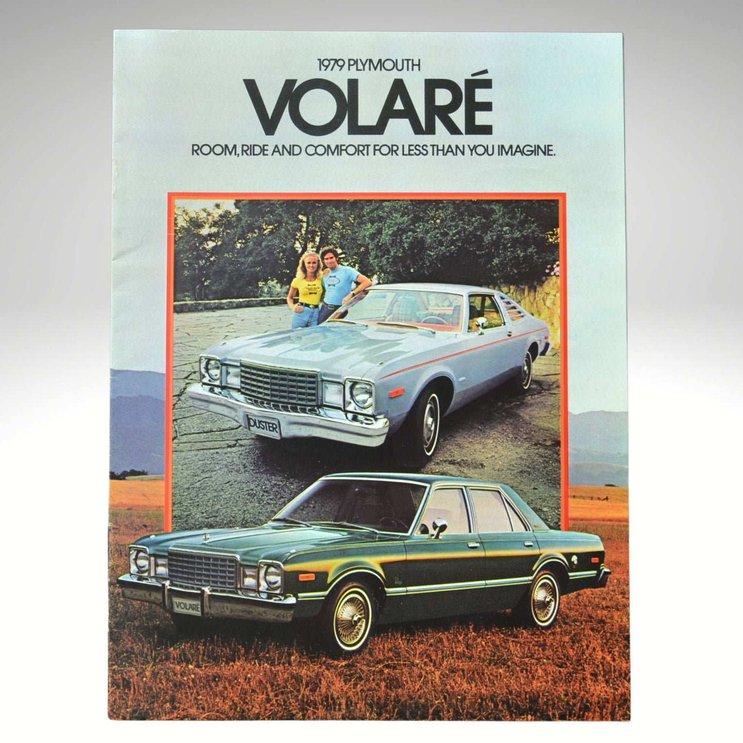 1979 Plymouth Volare advertisement with two cars and a family outdoors.
