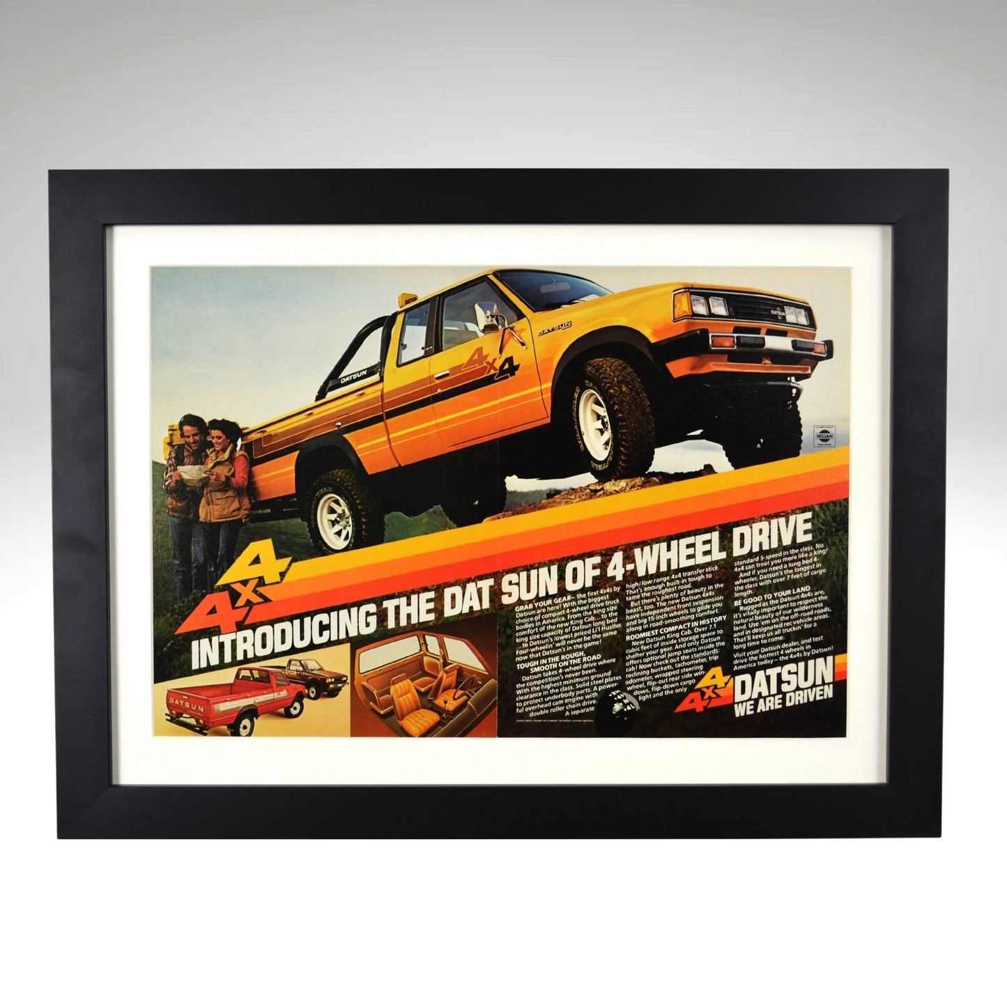 1980 Datsun 4x4 framed print ad featuring Nissan’s first factory 4-wheel-drive pickup, with bold graphics and a rugged off-road stance.