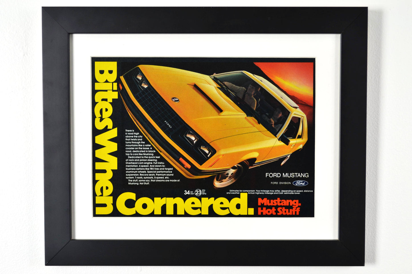 Framed 1981 Ford Mustang vintage print ad, featuring a bold yellow and black Mustang with the slogan "Bites When Cornered", perfect for collectors.