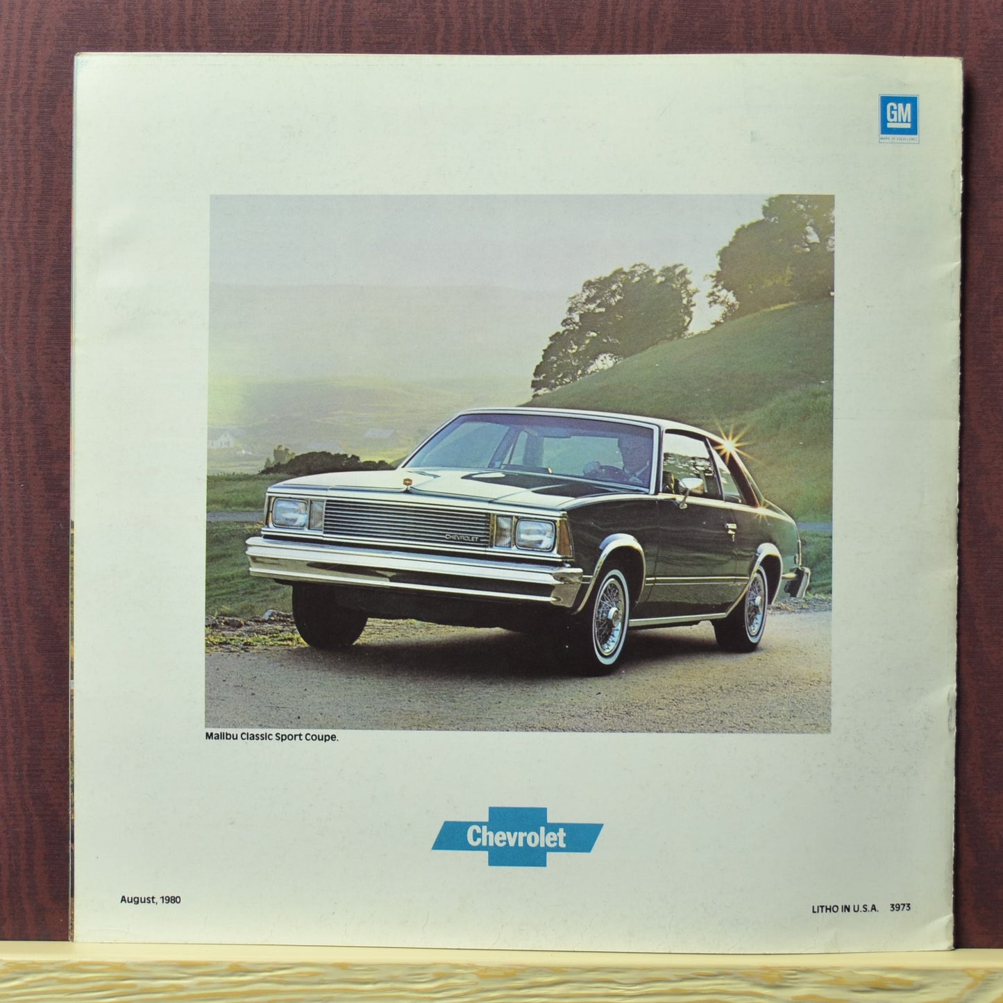 back cover 1981 Chevy Malibu sport cope brochure showing car in country hillside setting