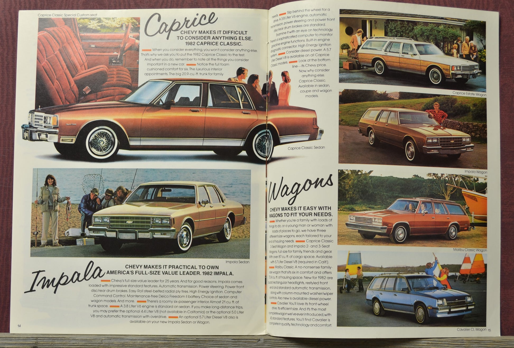 Open book showing vintage Chevrolet advertisements with cars and people.