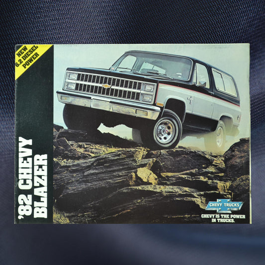 Front cover of the 1982 Chevy Blazer dealer sales brochure featuring a rugged squarebody Blazer on rocky terrain, showcasing its off-road capability.