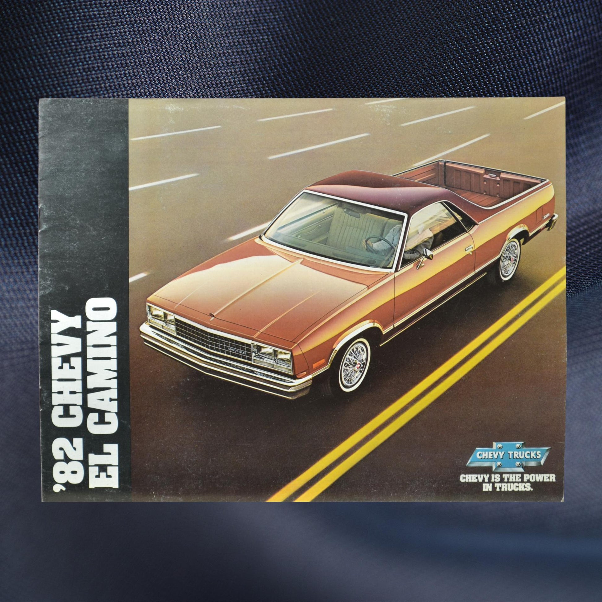 1982 Chevy El Camino dealer brochure front cover showcasing the Conquista edition in Light Redwood Metallic