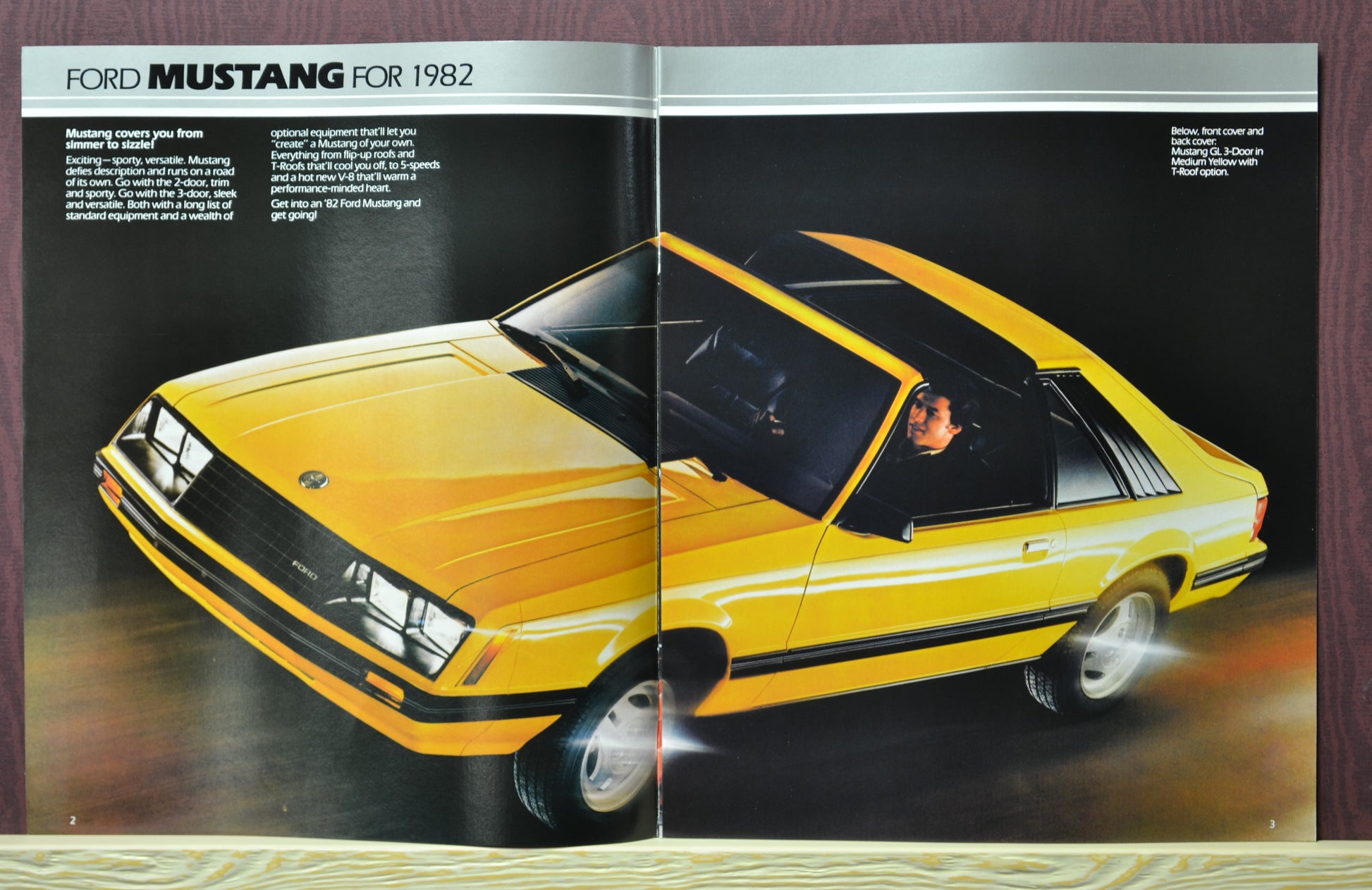 Interior pages of the 1982 Ford Mustang brochure showing the Mustang in yellow, with T-roof option