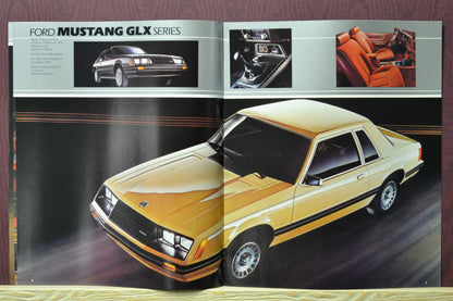 Interior pages of the 1982 Ford Mustang brochure showing the Mustang GLX in Yellow, dashboard details, and interior featuresl