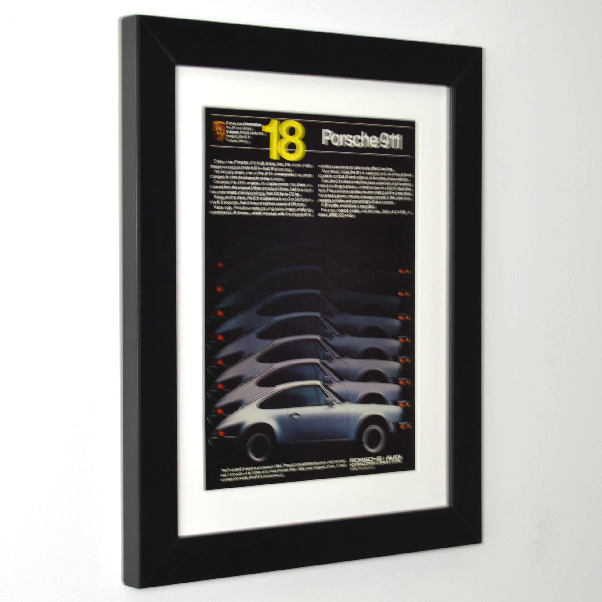 Framed 1982 Porsche 911 side profile print ad – vintage Porsche wall art with new frame, mat, and glass side view.
