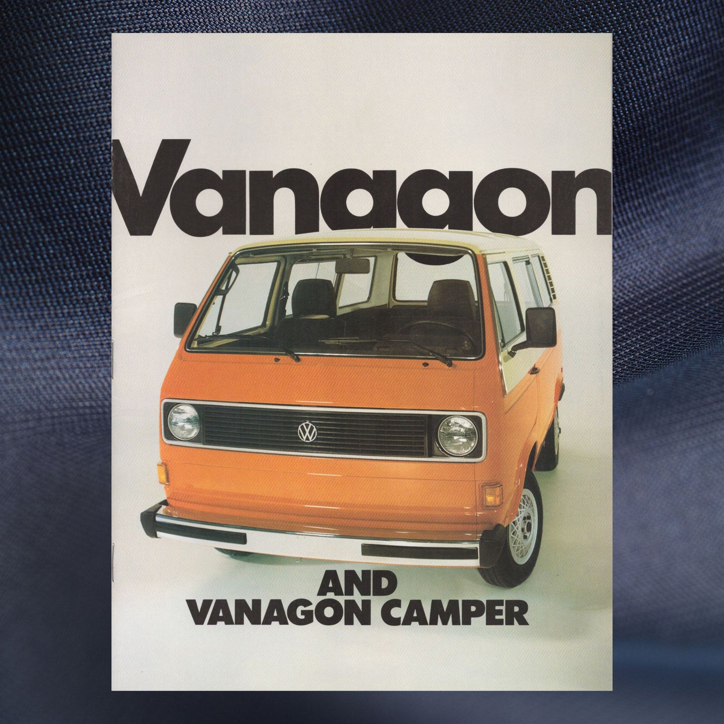 Advertisement for 1982 Volkswagen Vanagon and Vanagon Camper with an orange van on a white background.