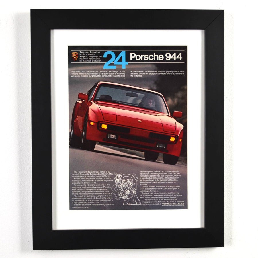 Framed 1983 Porsche 944 print ad with red 944 and cutaway diagram – vintage automotive wall art with new frame, mat, and glass