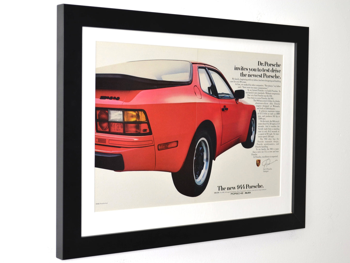 Framed 1983 red Porsche 944 print ad – rear view with Dr. Porsche message side view

