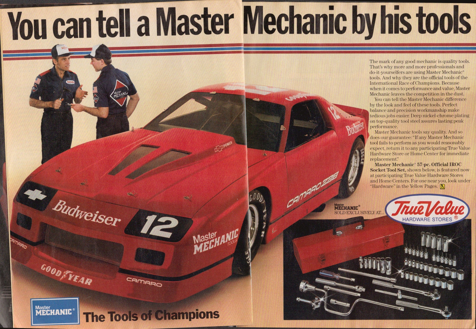 Advertisement featuring a red car with 'Budweiser' and 'Master Mechanic' branding, alongside two mechanics and tool set.