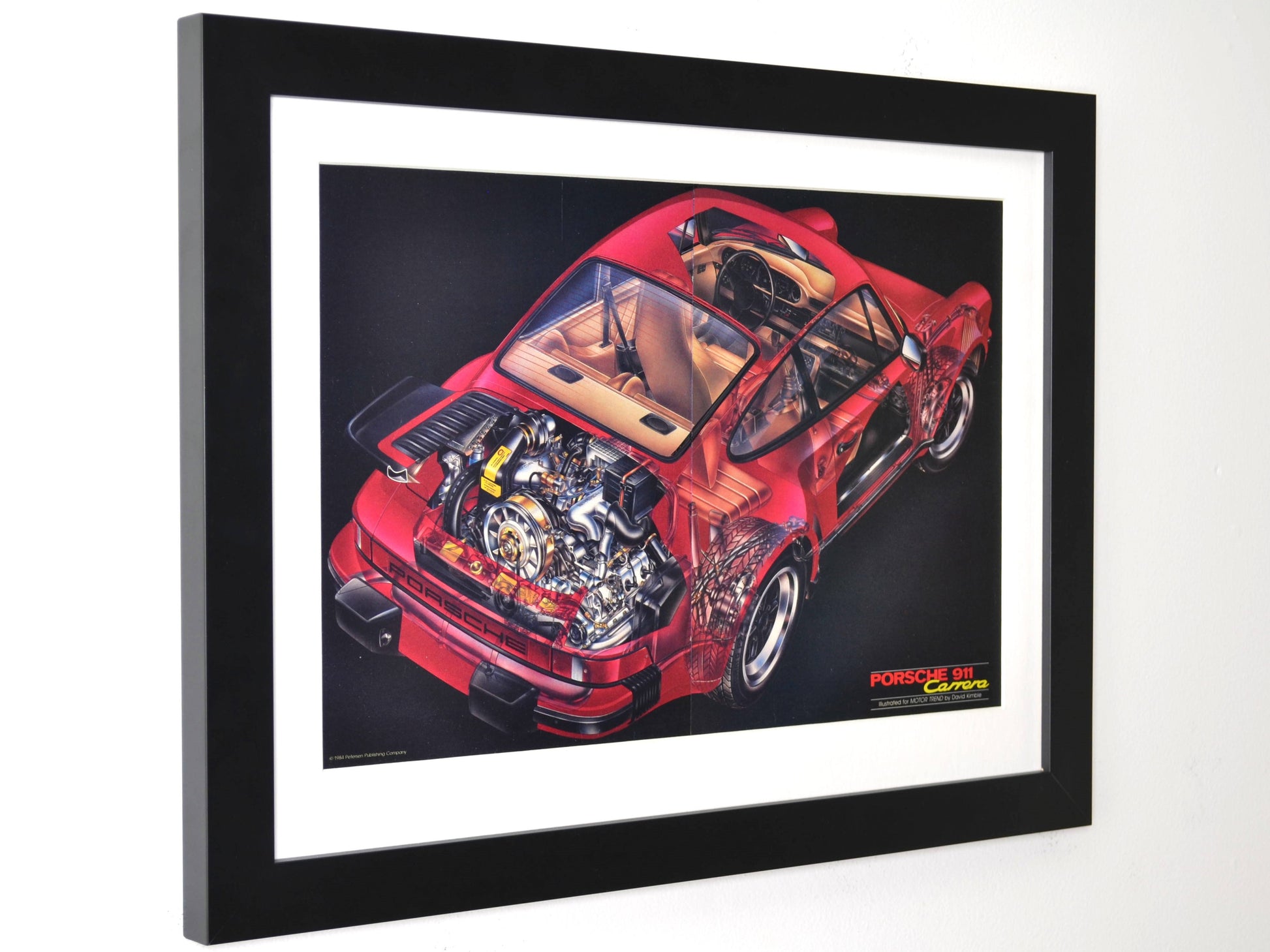 Framed 15x20 print of 1984 Porsche 911 Carrera ad with full technical cutaway view in red on black background side view