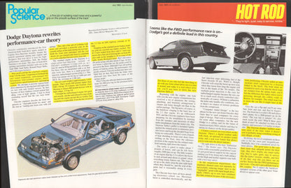 An open magazine spread featuring an article about the Dodge Daytona, with a blue car illustration on the left page and automotive text and photos on the right page. The magazine pages have a black border and are photographed against a dark background.