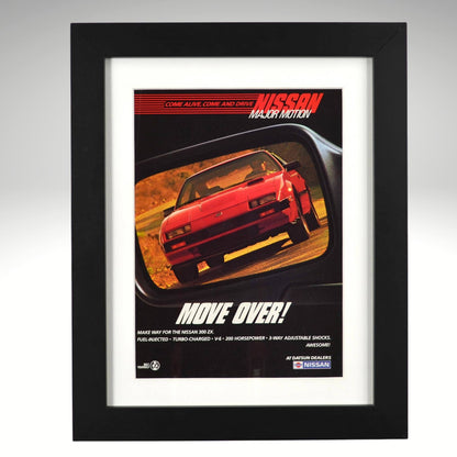 Framed 1984 Nissan 300ZX Turbo vintage print ad with “Move Over!” headline, showing the red 300ZX reflected in a rearview mirror — authentic JDM wall art for collectors and Z enthusiasts.