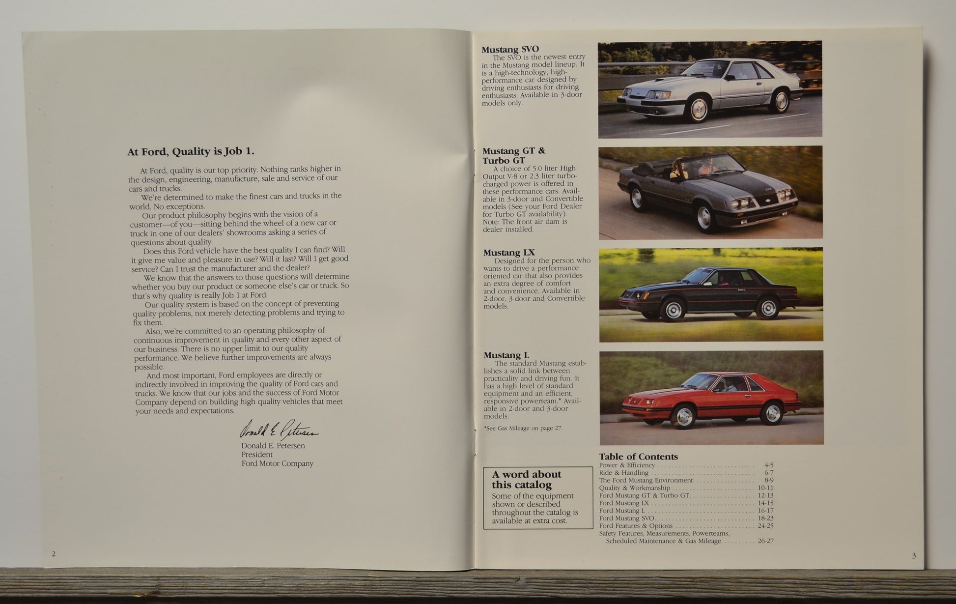 Open brochure with text and images of Ford mustang models covered in catalogue