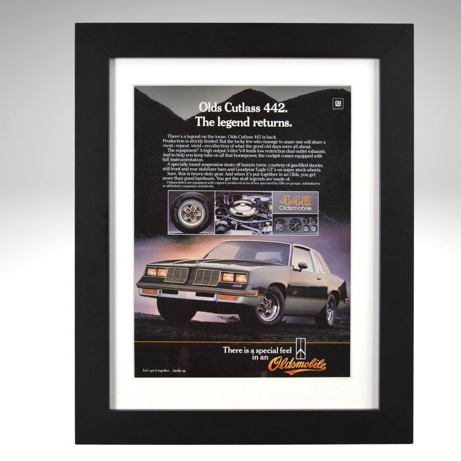 Framed 1984 Oldsmobile 442 ad – vintage print with silver Cutlass, 442 badge, and performance callouts.
