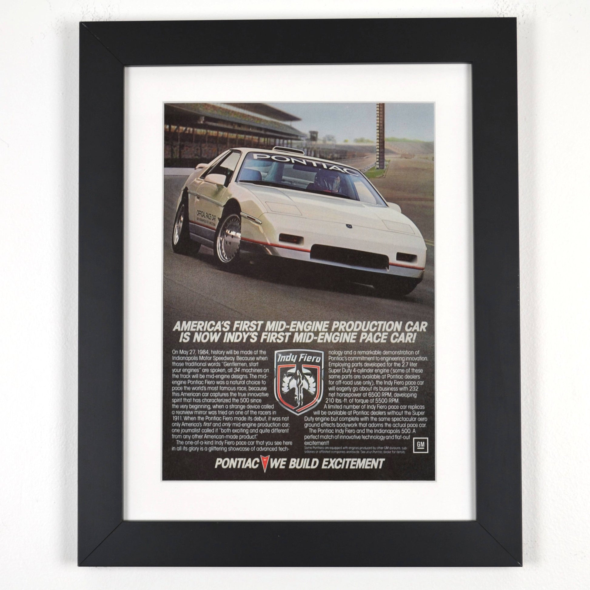 Framed 1984 Pontiac Fiero Indy Pace Car Ad