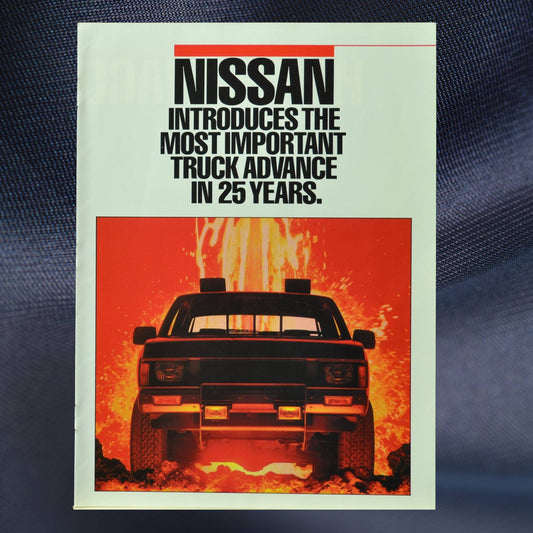 Cover of 1986 Nissan Hardbody brochure with lava background