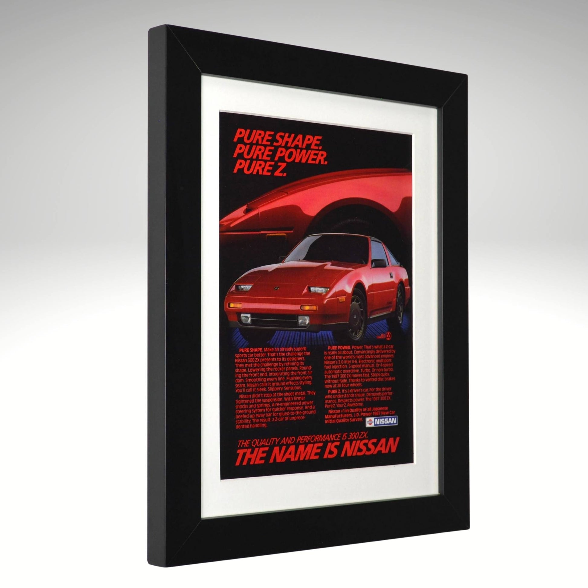 Framed poster of a red Nissan 300 ZX car with text on a gray background