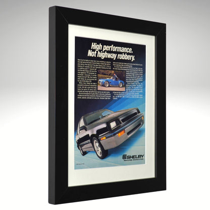 Framed advertisement for Shelby cars with a black border
