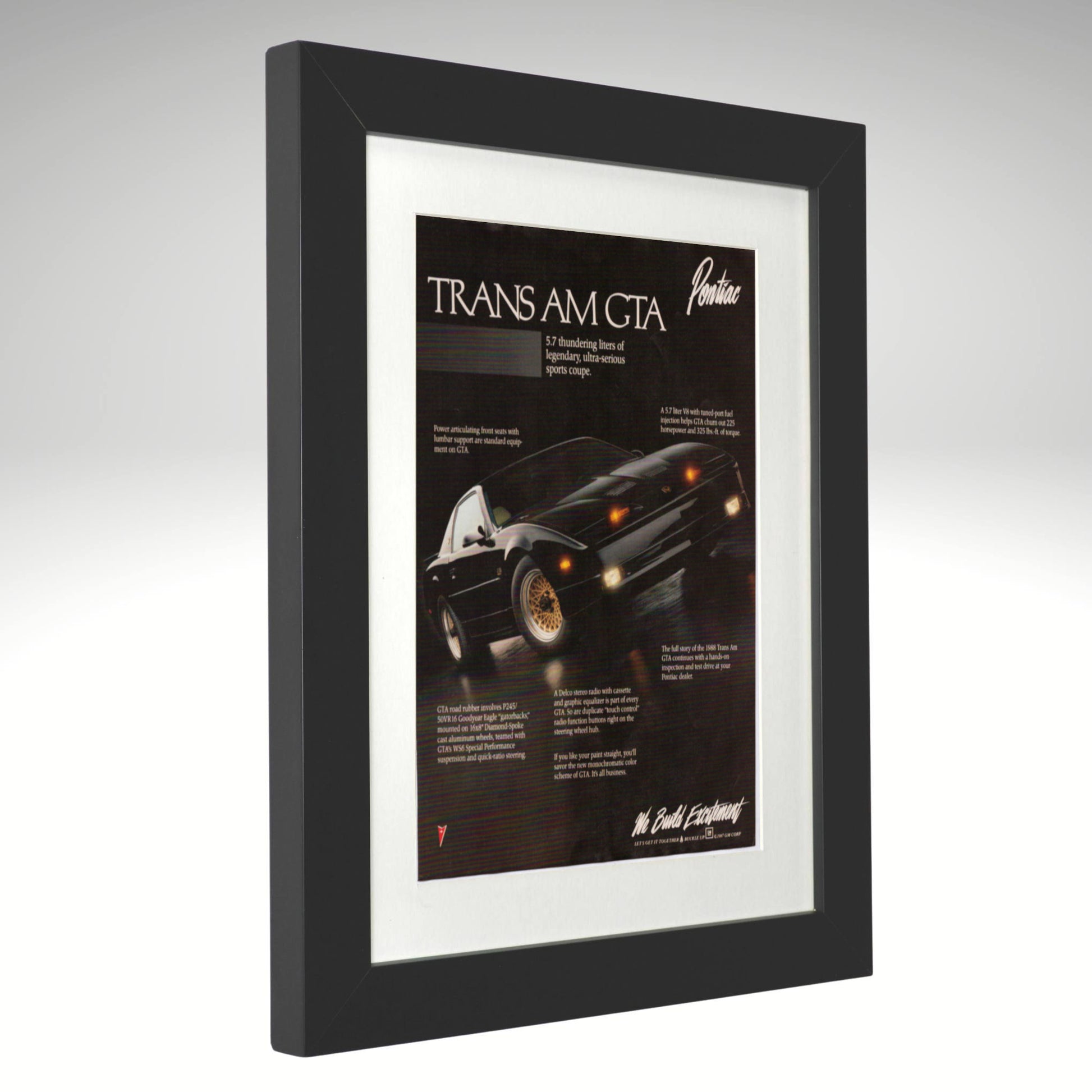 Framed advertisement of a Pontiac Trans Am GTA on a gray background