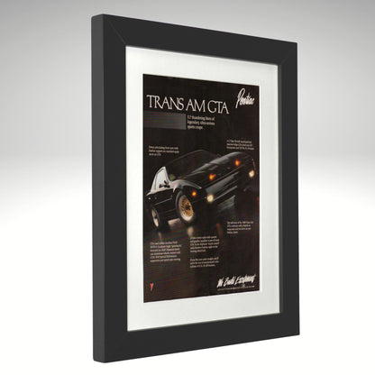 Framed advertisement of a Pontiac Trans Am GTA on a gray background
