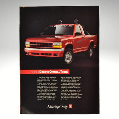 Red Dodge Dakota truck on a black background with 'Advantage Dodge' branding.