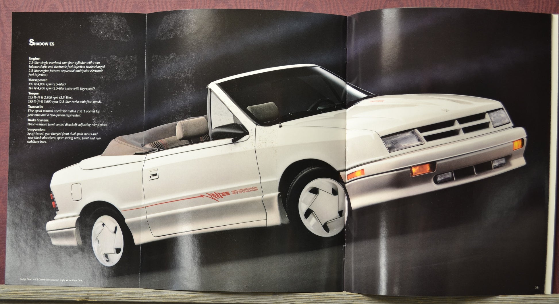 White1992 dodge shadow es on a dark background with text on the left side