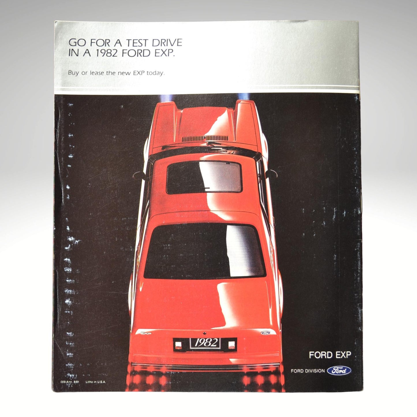 Advertisement for 1982 Ford EXP truck with a red truck on a black background.