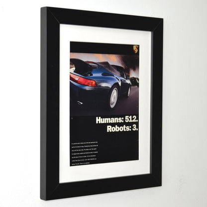 Framed 1995 Porsche 911 Carrera Cabriolet ad – Humans 512 Robots 3 – vintage Porsche print with new frame, mat, and glass side view
