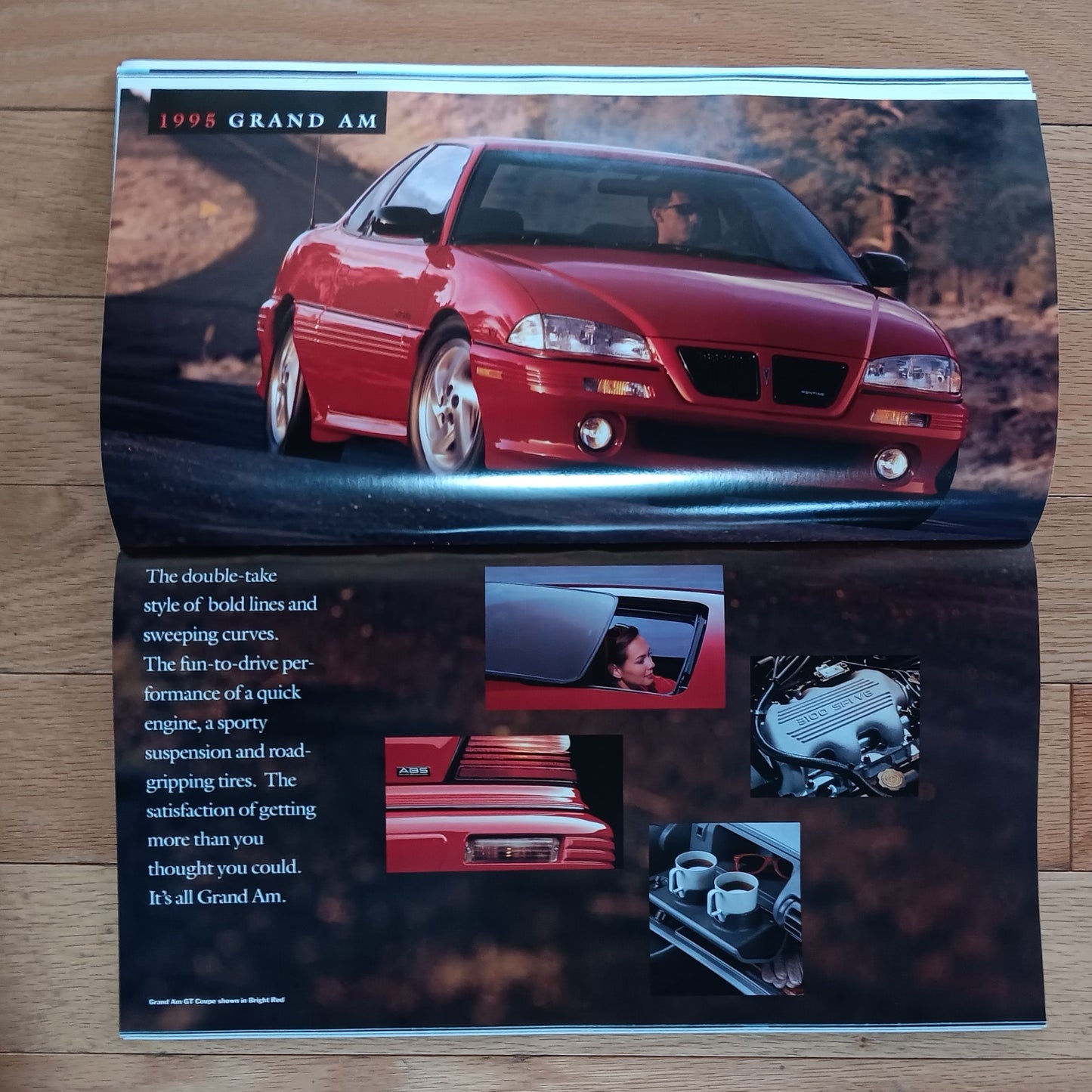 1998 Grand Am advertisement on a wooden surface