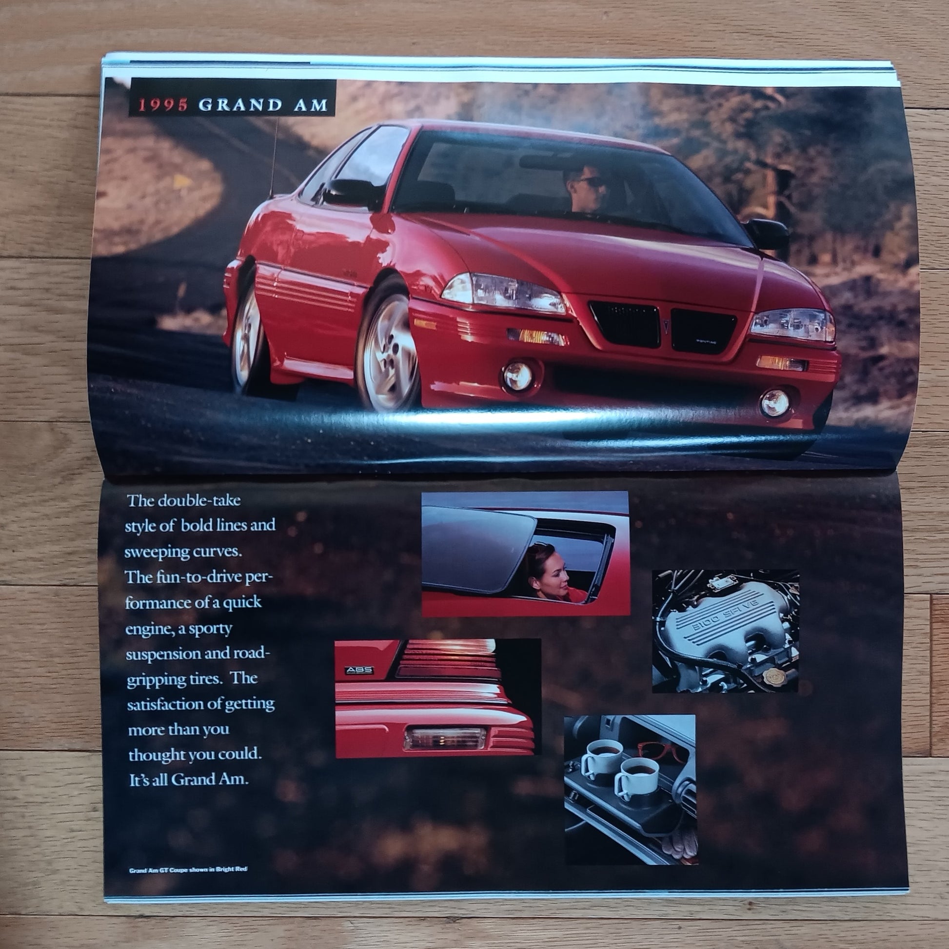 1998 Grand Am advertisement on a wooden surface
