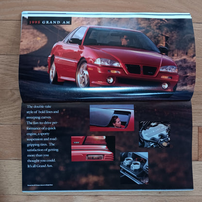 1998 Grand Am advertisement on a wooden surface
