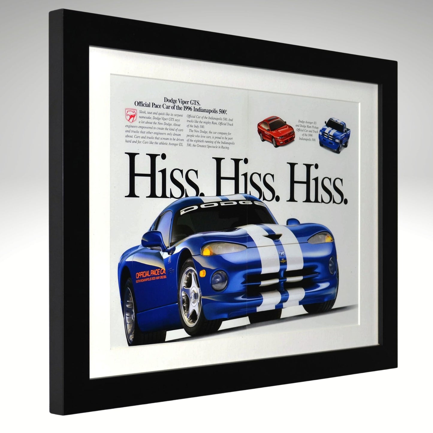 Framed advertisement of a blue Dodge Viper with text 'Hiss. Hiss. Hiss.' on a white background.