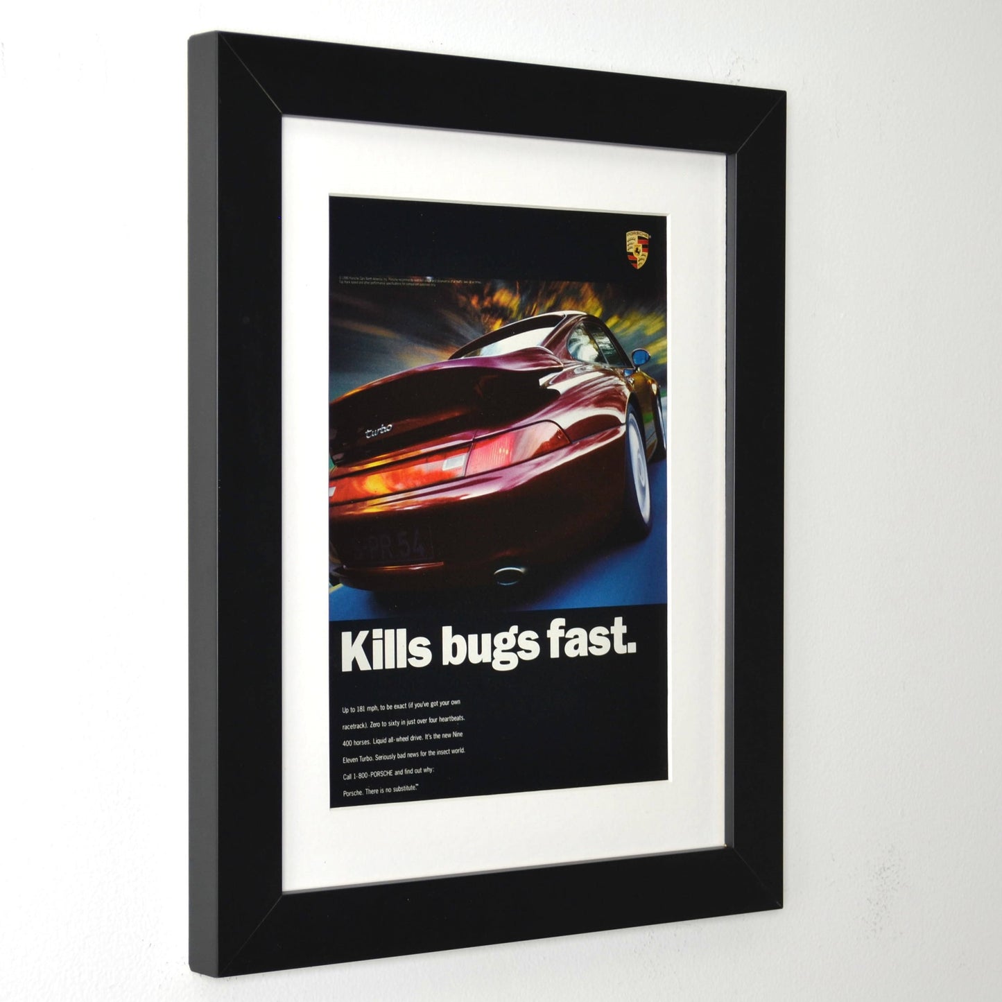 Framed 1996 Porsche 911 Turbo print ad with “Kills Bugs Fast” headline – vintage automotive wall art with new frame, mat, and glass side view