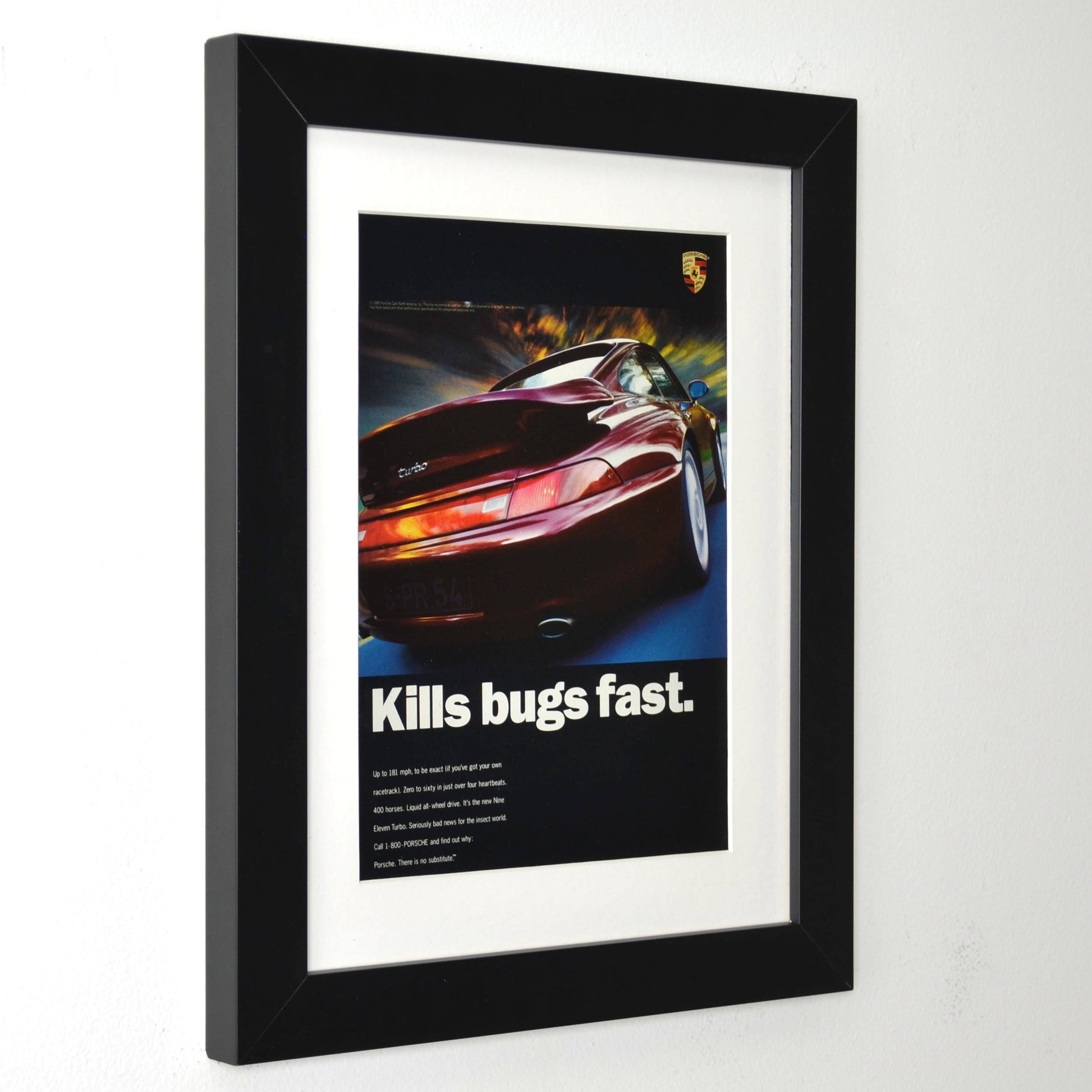 Framed 1996 Porsche 911 Turbo print ad with “Kills Bugs Fast” headline – vintage automotive wall art with new frame, mat, and glass side view