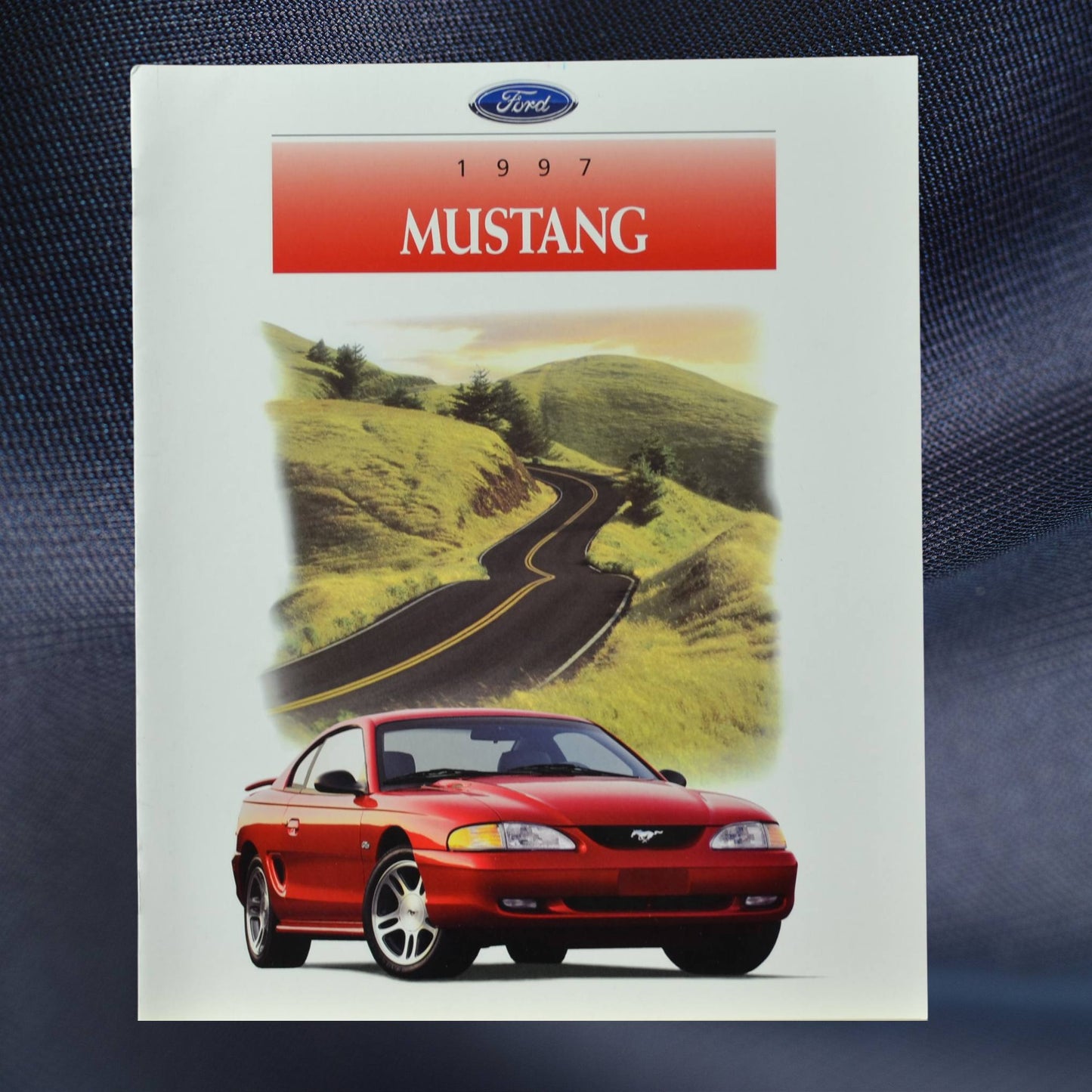 1997 Ford Mustang Dealer Brochure front cover with red mustang