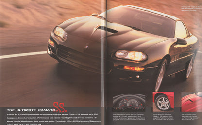 A vintage magazine-style car advertisement featuring a dark metallic Camaro SS sports car on a road with desert scenery in the background. The ad includes text, instrument panel inset, and wheel detail inset.