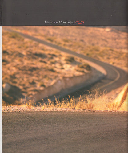 A Genuine Chevrolet branded advertisement or booklet page featuring a winding road through dry, sunlit hills under a dark header with the Chevrolet name and logo.
