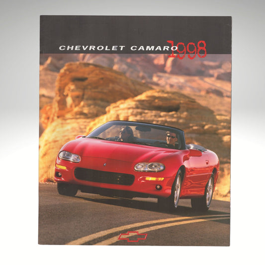 A vintage 2008 Chevrolet Camaro brochure or booklet cover featuring a red convertible sports car driving on a road with desert rock formations in the background.