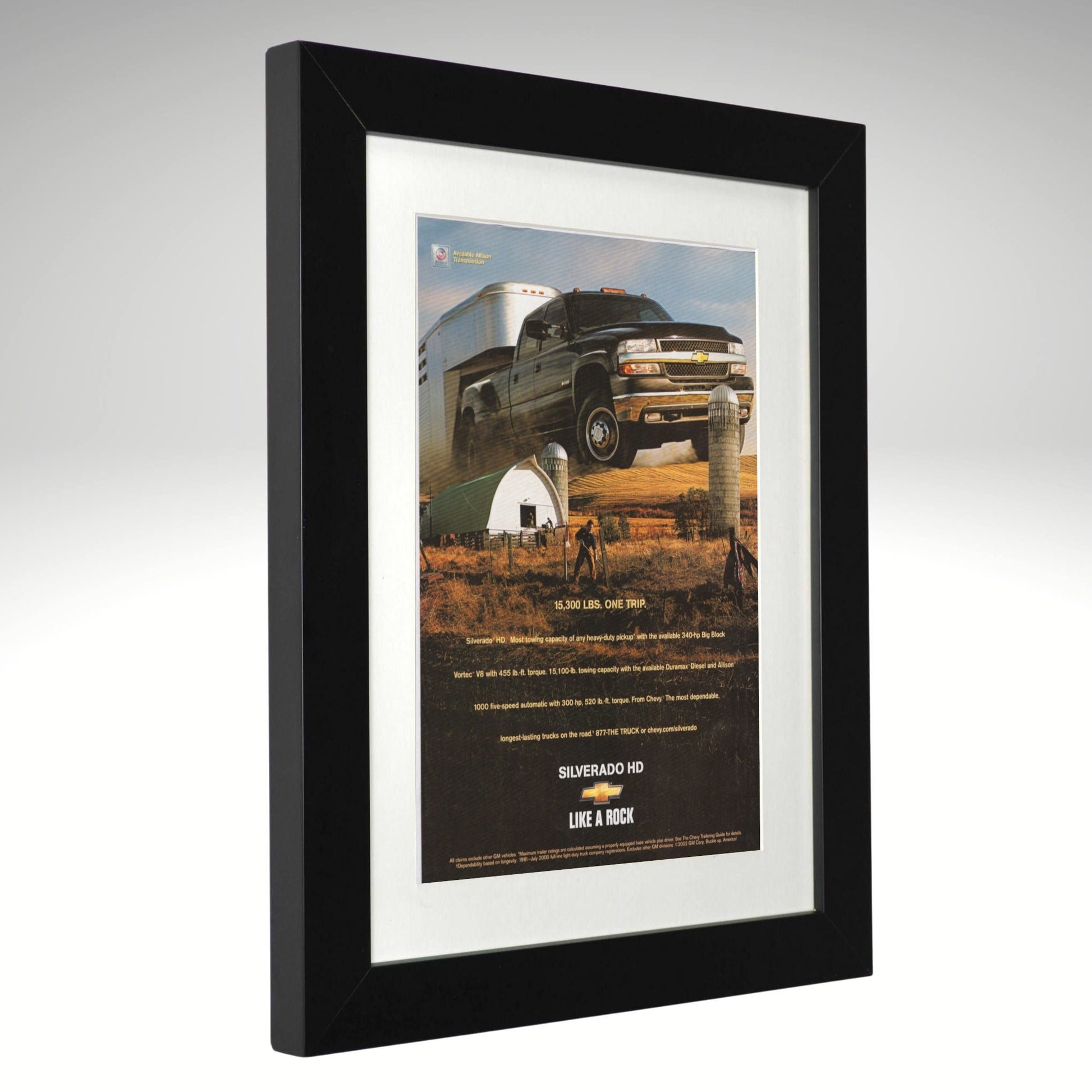 Framed advertisement for Chevrolet Silverado HD truck on a white background
