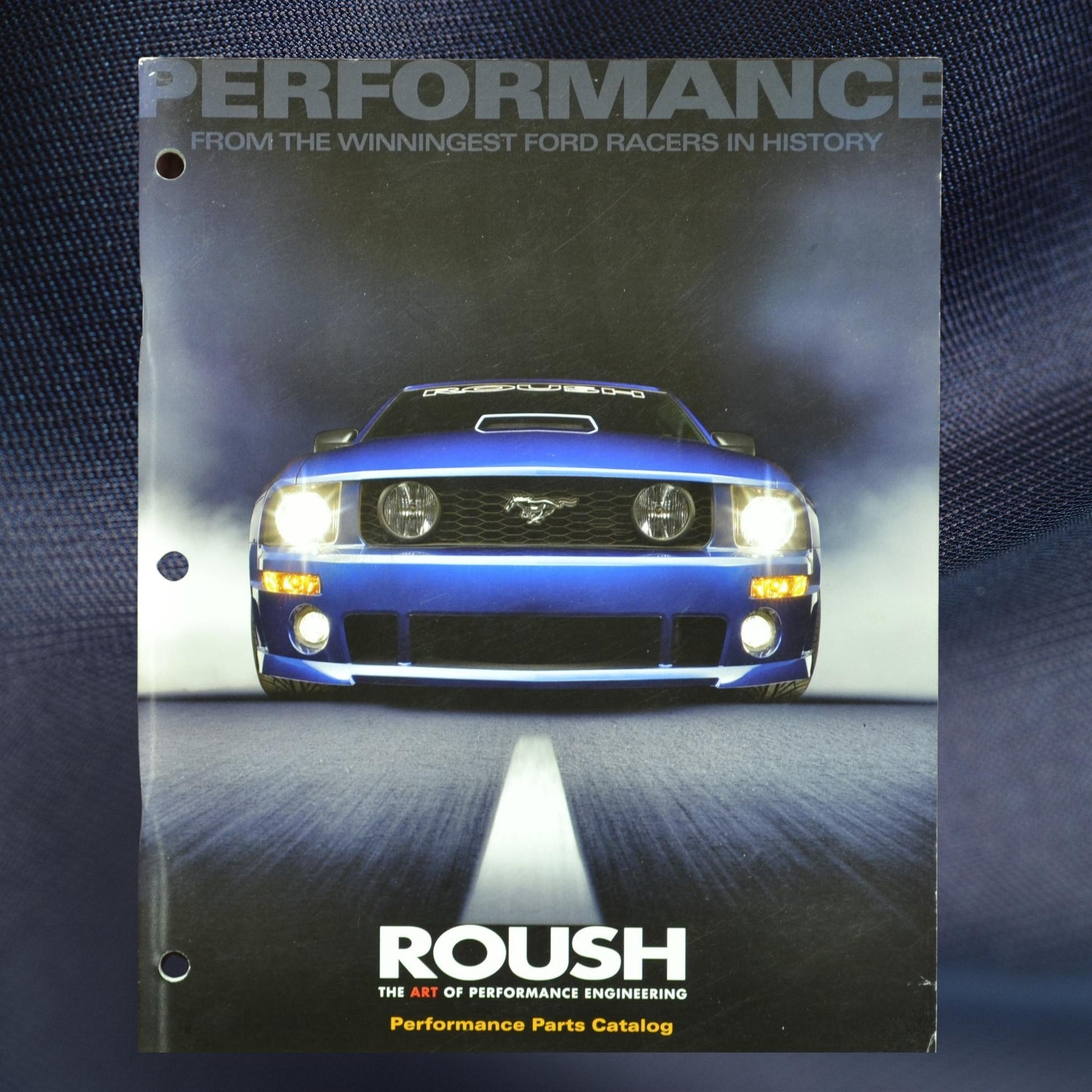 2007 Roush Performance Parts Catalog featuring a blue Ford Mustang with content on Mustang and Ford racing parts, RoushChargers, and accessories