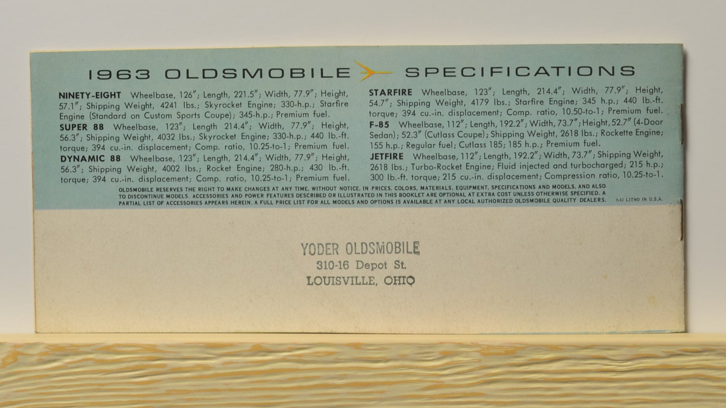 Back page with 1963 Oldsmobile model specifications and Yoder Oldsmobile stamp

