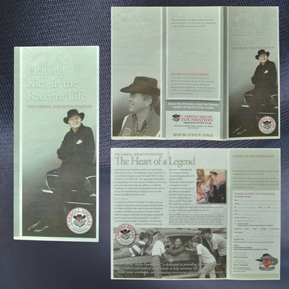 Carroll Shelby Foundation tri-fold pamphlet, titled 'Helping Kids in the Race for Life.' Features Carroll Shelby on the cover, with interior details on the foundation’s mission, heart transplant advocacy, and donation information. Authentic memorabilia from the John Barnes Collection