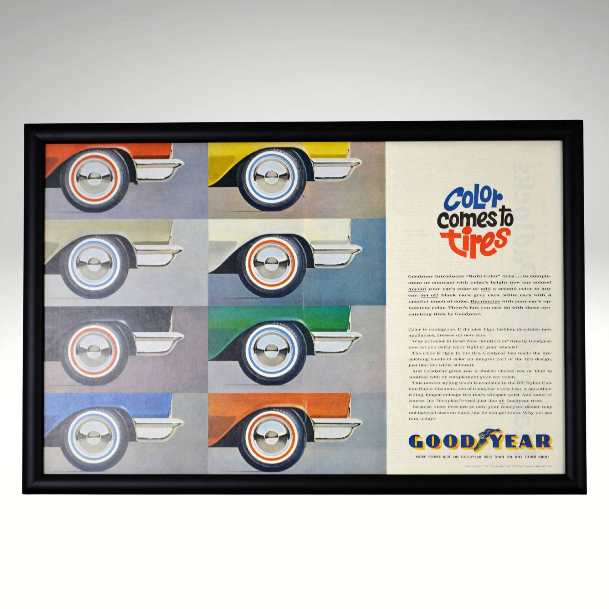 1960 Goodyear Multi-Color Tire Ad – Framed Retro Wall Art featuring rare colored sidewall tires, professionally framed in a satin black 1” frame, perfect for vintage automotive decor, garage art, and petroliana collectors