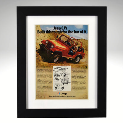 Framed advertisement for Jeep CJ with text 'Built this tough for the fun of it' on a desert background.