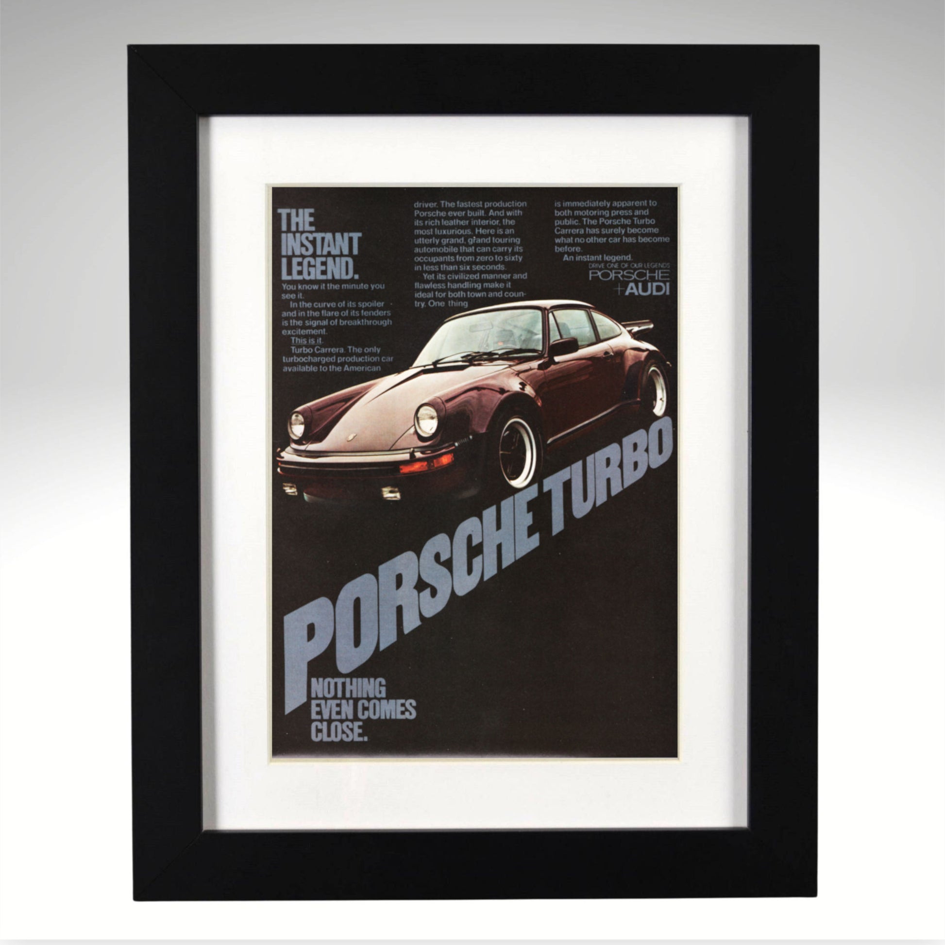 Framed poster of a Porsche Turbo car with text on a gray background