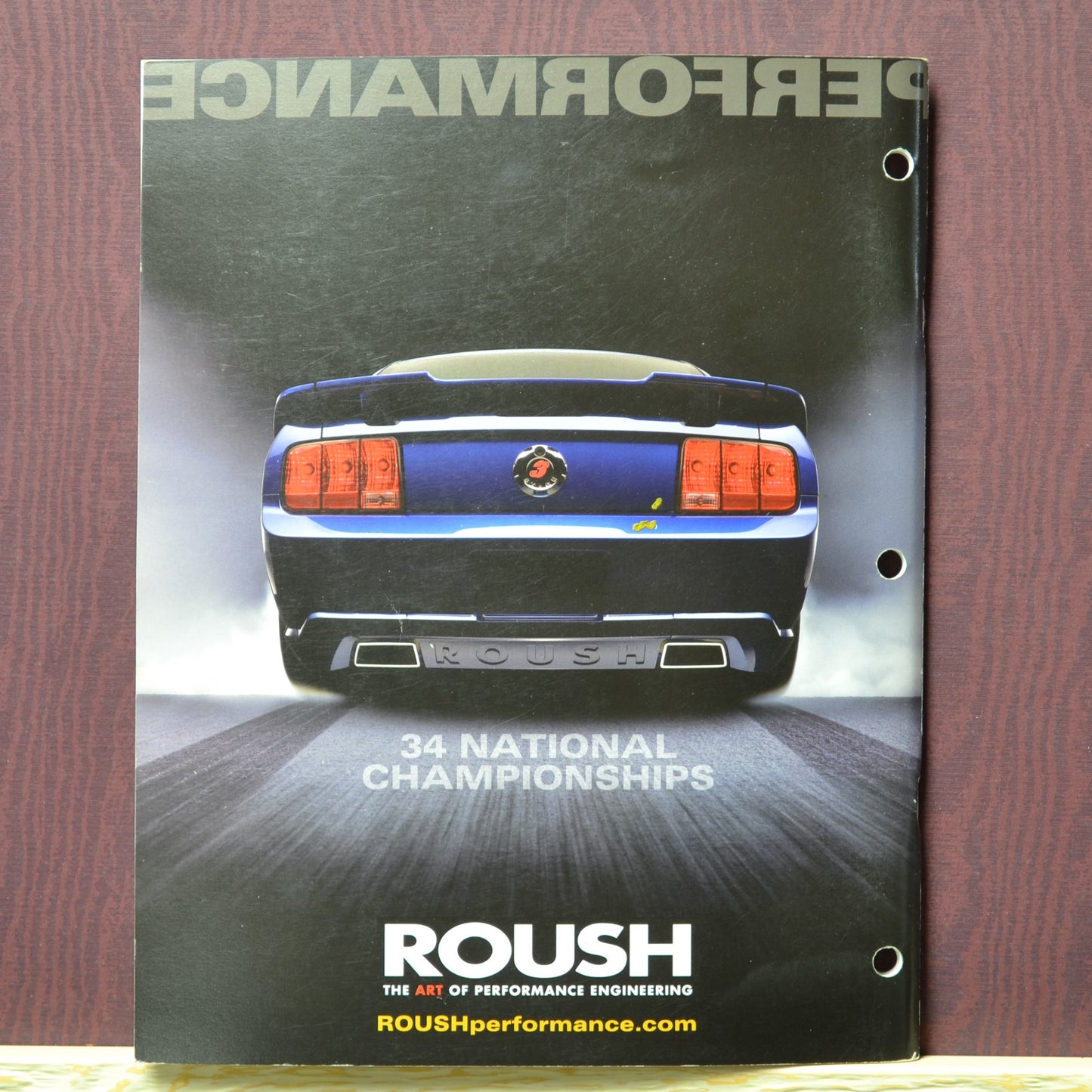 Back page of the 2007 Roush Performance Parts Catalog with a blue Roush mustang boasting 34 national championships