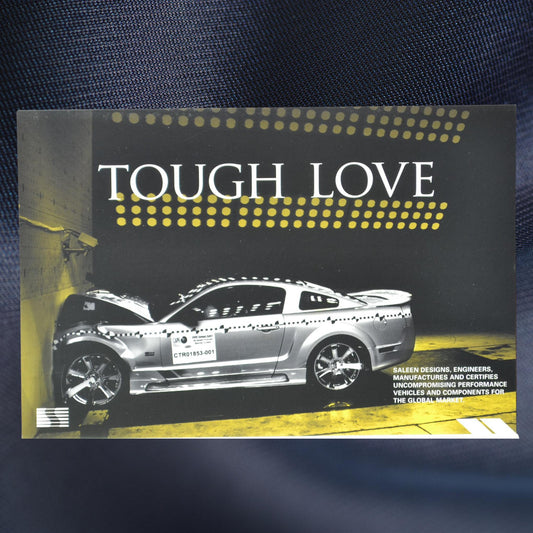 Saleen Performance promo card front featuring a silver Mustang in a crash test with the text 'Tough Love.'