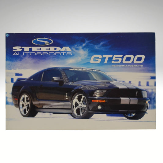 Promotional poster for Steeda Autosports GT500 performance parts with a black car on a blue and white background.